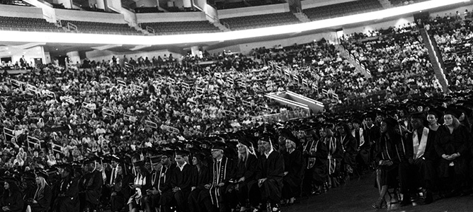 Black and white image of graduates and audience at Ashworth College’s 2024 graduation ceremony. Black and white image of graduates and audience at Ashworth College’s 2024 graduation ceremony.
