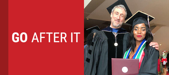 Female college graduate accepts diploma