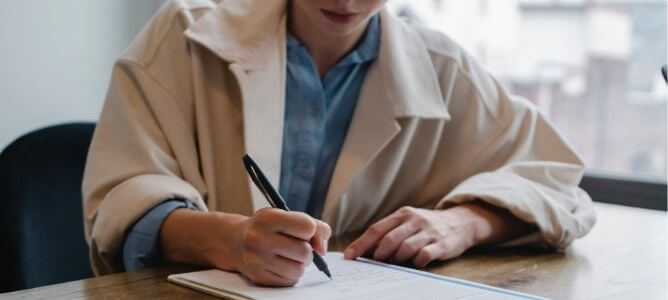 Woman filling out job application.