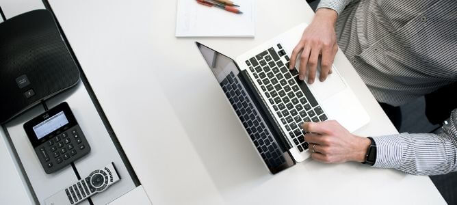 Man working on laptop.
